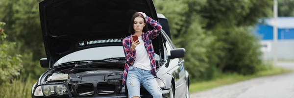 long-shot-woman-sitting-car